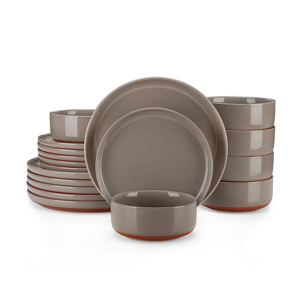 Brown stoneware dinnerware sets with plates and bowls featuring terracotta base, arranged on a white background.