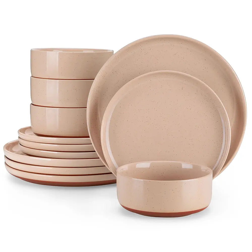 Set of beige ceramic dinnerware including bowls and plates on a white background