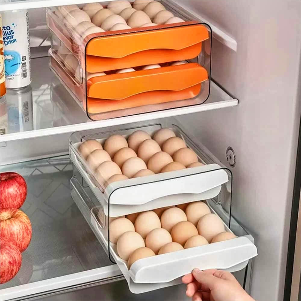 Hand pulling white egg organizer for fridge with two drawers of eggs, placed near orange container for neat fridge organization.