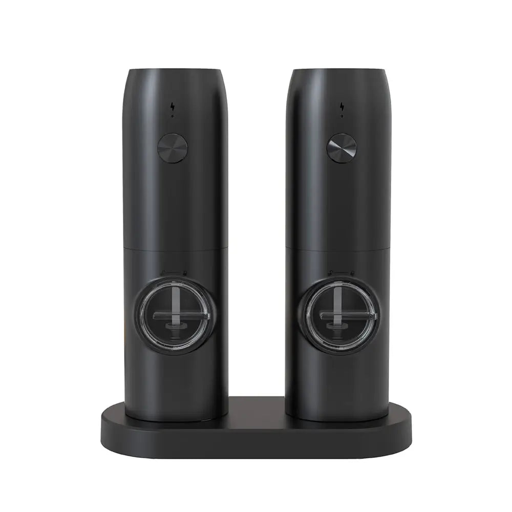 Black electric salt and pepper mills on matching stand, featuring clear spice windows and push button controls, isolated on white background.