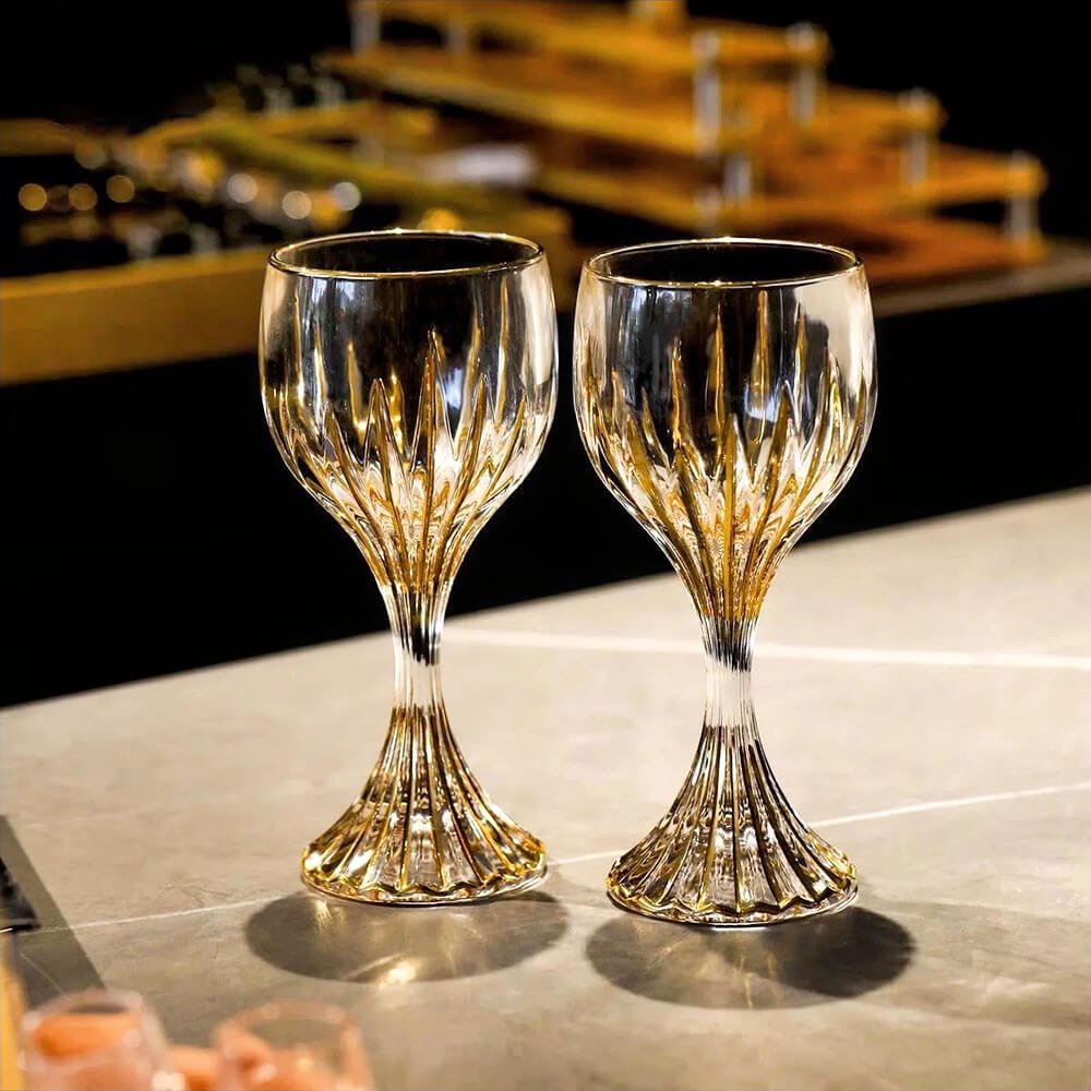 Elegant goblet cocktail glasses with gold trim, perfect for wine, cocktails, or upscale dining and home bar decor.