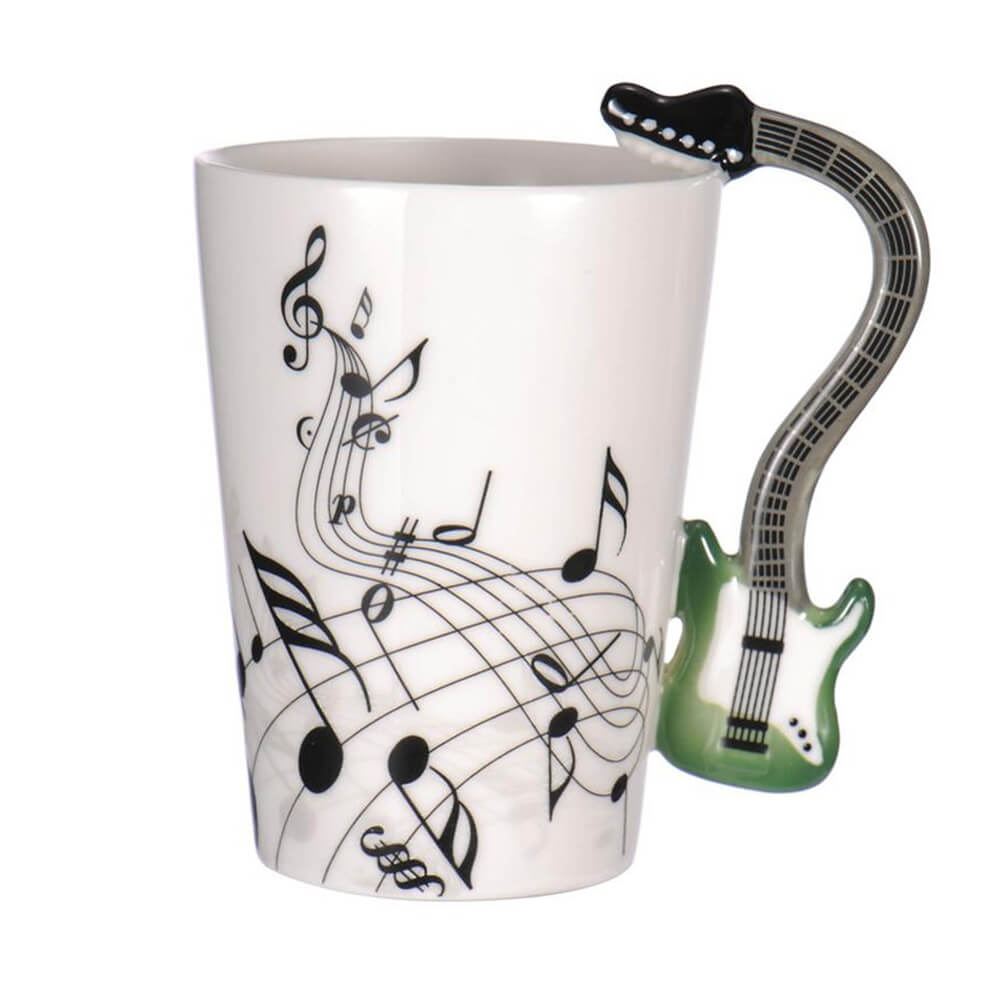 White guitar coffee mug with black music notes and a green electric guitar handle, ideal for musicians and music-themed gifts.