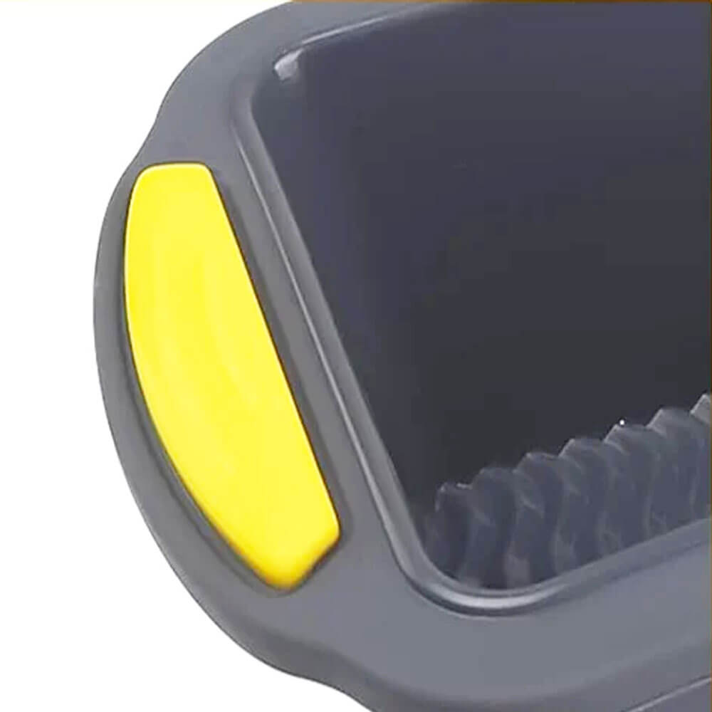 Close-up of a holiday loaf pan gift set showing the non-stick interior and yellow silicone grip handle.