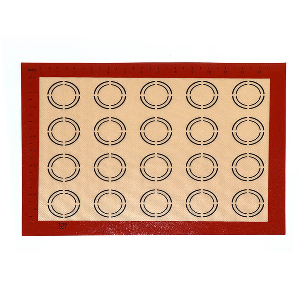 Macaron silicone baking mat with circular guides and red border.