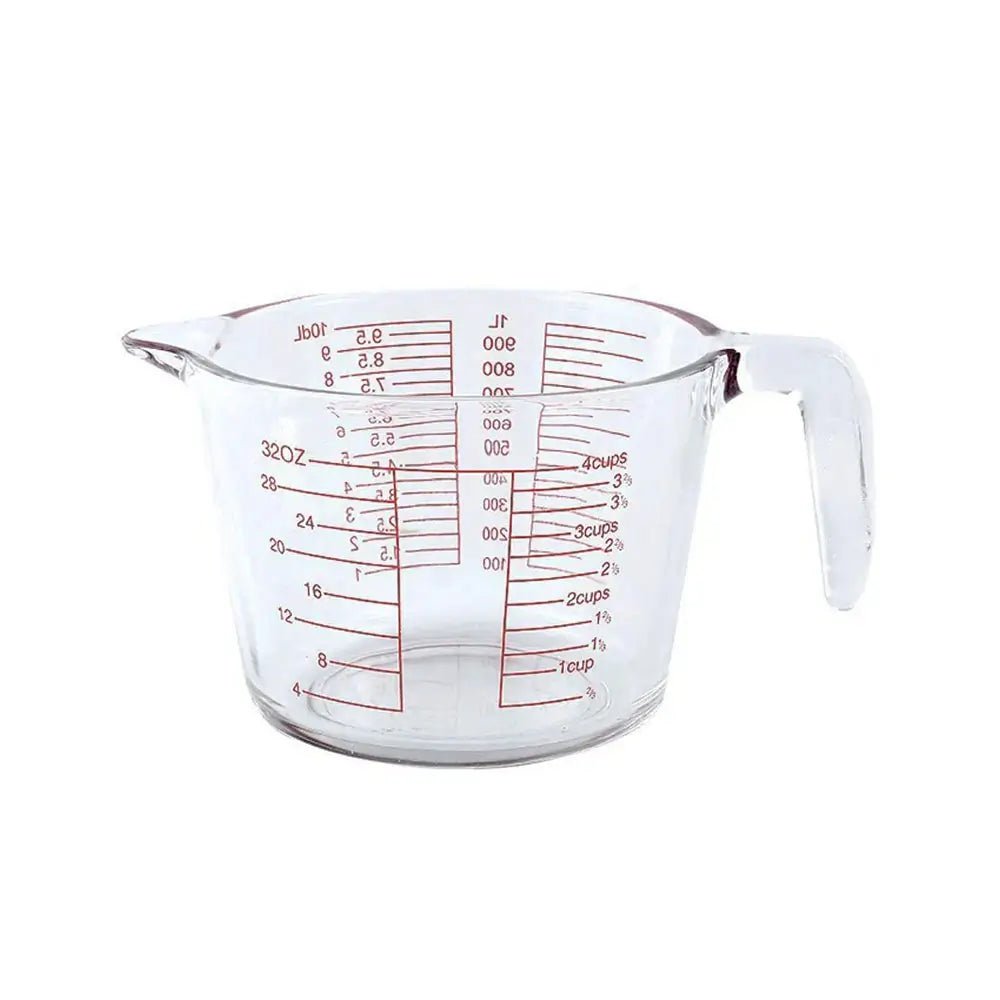Clear measuring cup glass with red markings for cups, ounces, and milliliters. Perfect for accurate liquid and dry ingredient measuring.