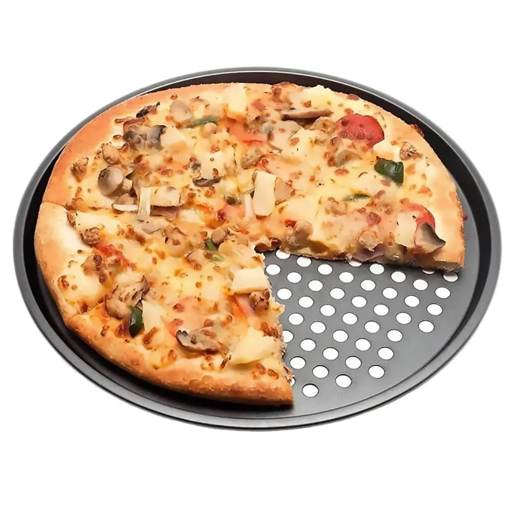 Vegetable pizza with a missing slice placed on a round perforated pizza crisper pan against a white background.