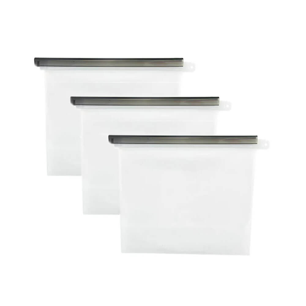 Set of three transparent reusable silicone steamer bags with black sealing bars, aligned in a staggered row on a plain white background.