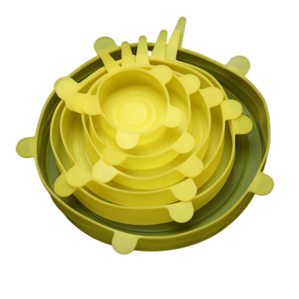 Stacked set of yellow reusable silicone stretch lids in multiple sizes, each with circular grips around the edges.