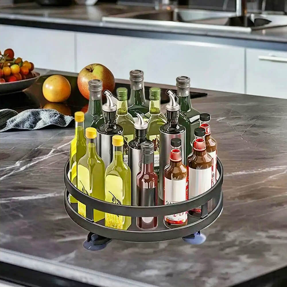 A rotating spice rack for cabinet holding multiple oil and sauce bottles, displayed on a kitchen countertop for organized storage.