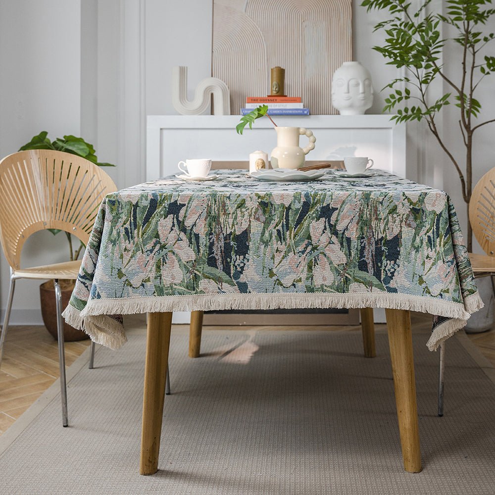 square tablecloth has a line of embroidered flowers