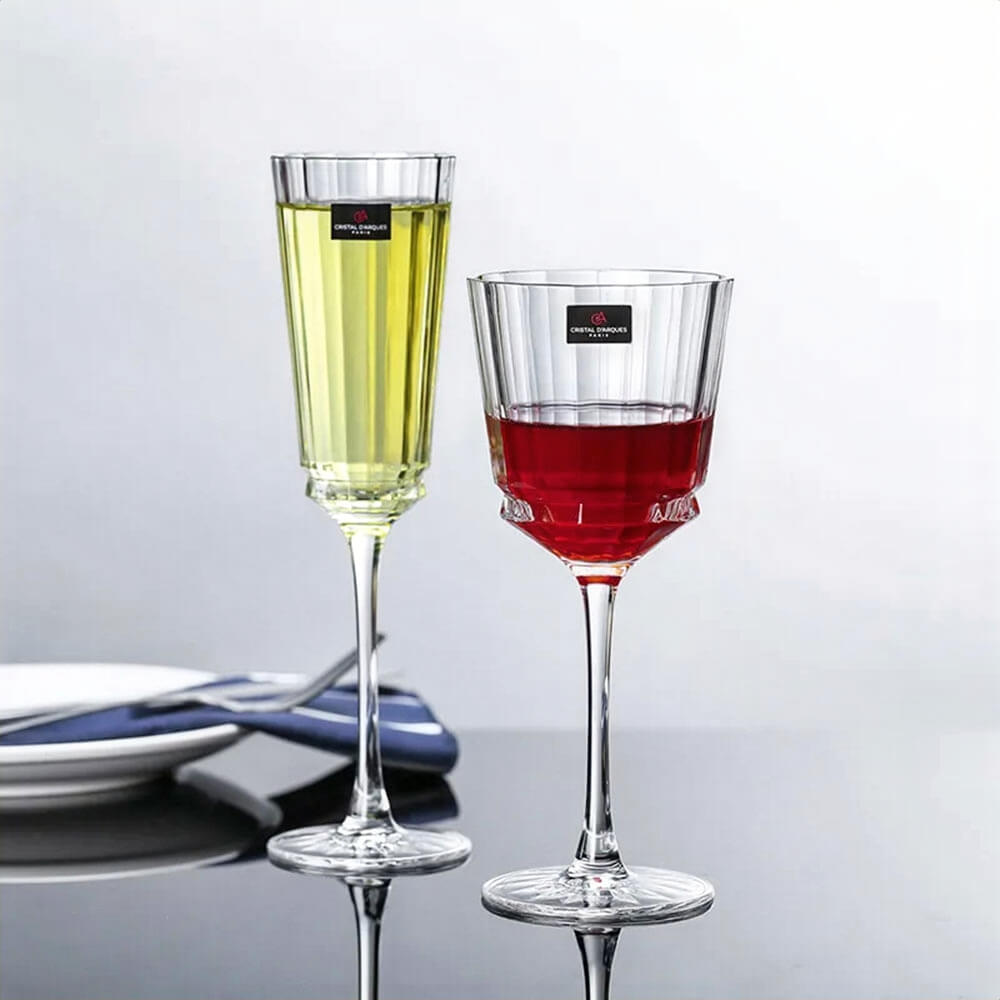 Stemless glass champagne flutes with crystal-cut design, ideal for sparkling wine and cocktails.