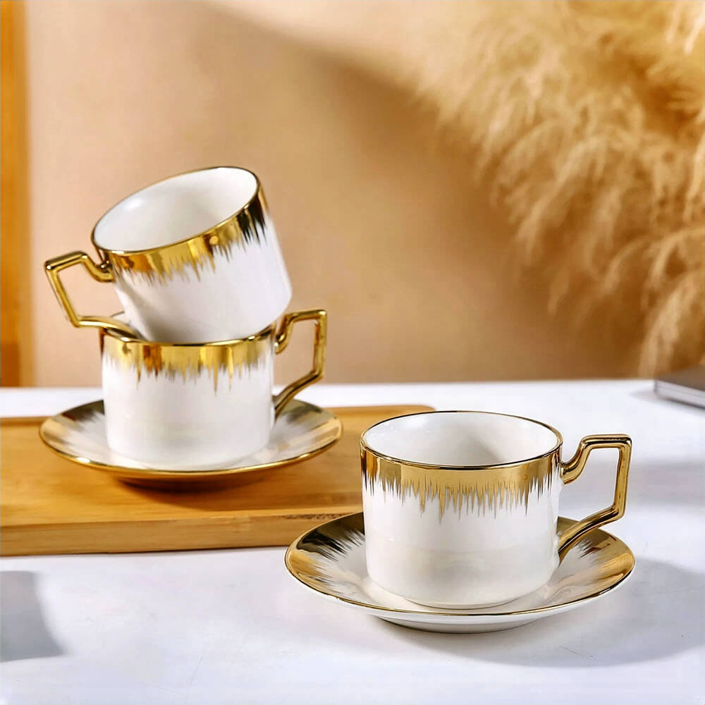 Tea cups and saucers set of 6 with elegant white porcelain and gold accents, perfect for serving tea in luxury and style.