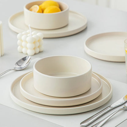 Dinner plate, salad plate, and cereal bowl displayed on the dining table, part of the 16-piece dinnerware set stoneware.