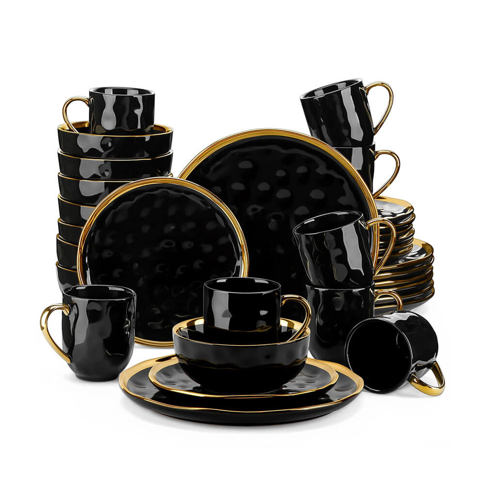 A 16-piece dinnerware set stoneware collection featuring a textured black design with glossy gold accents. The set includes dinner plates, salad plates, bowls, and mugs, all with a luxurious black finish. The rims of the plates and bowls, along with the handles of the mugs, are highlighted in metallic gold, enhancing the set&