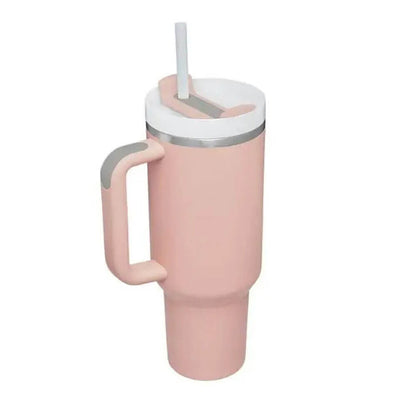 A sleek pink 20 oz stainless steel tumbler with a sturdy handle, a secure lid, and a straw, designed for hot or cold drinks and perfect for on-the-go use.