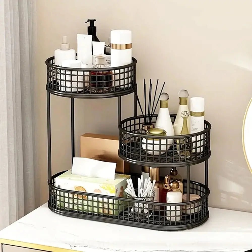 Black metal tiered organizer with various items on a neutral background.