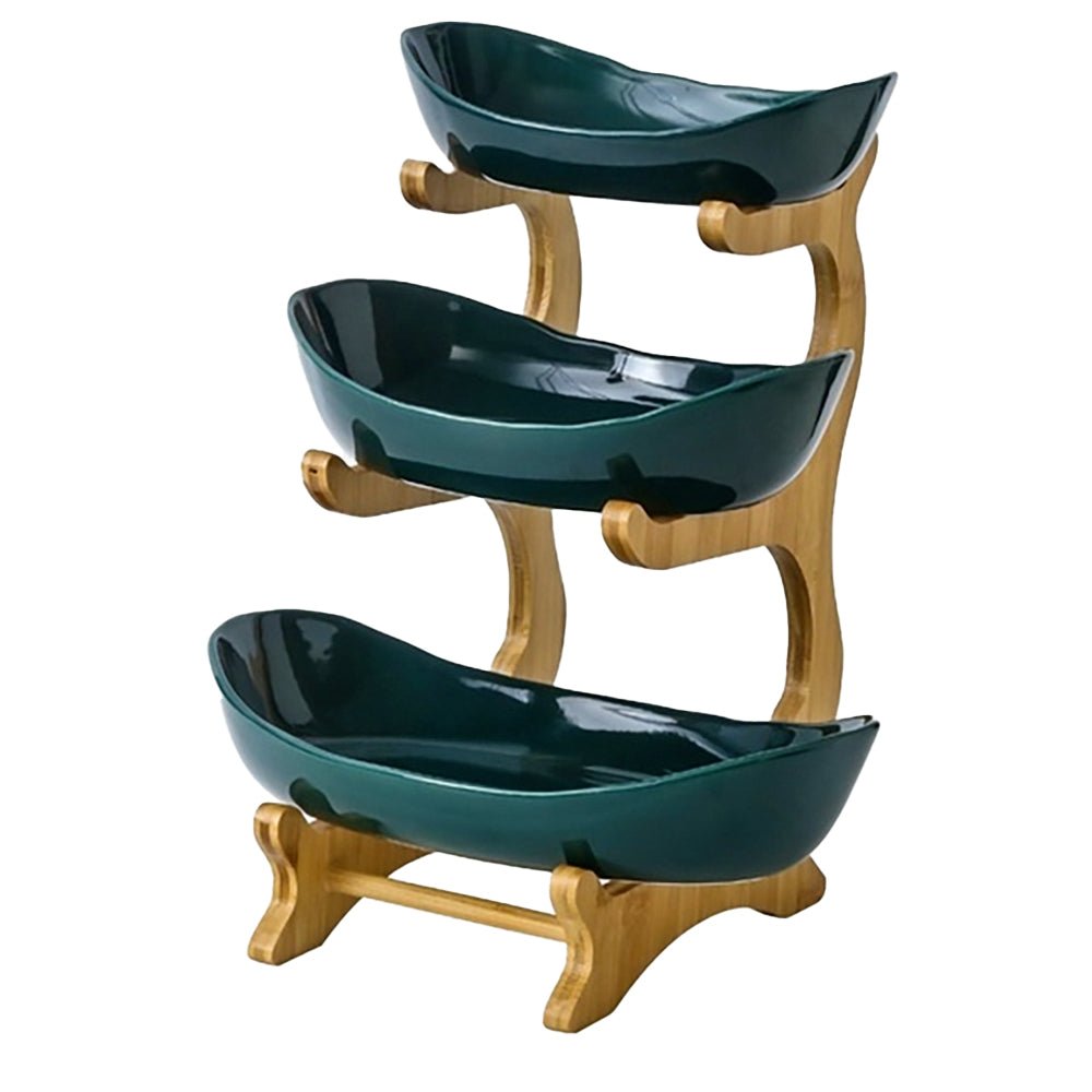 A green 3-tier fruit bowl, elegantly designed to display and organize a variety of fresh fruits.