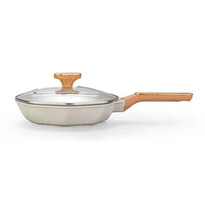White frying pan with a wooden handle and a lid handle on a white background