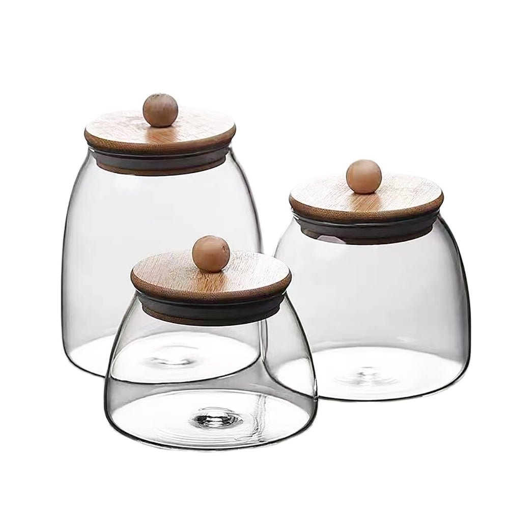 Set of three bamboo and glass spice jars with airtight lids, perfect for stylish kitchen storage.