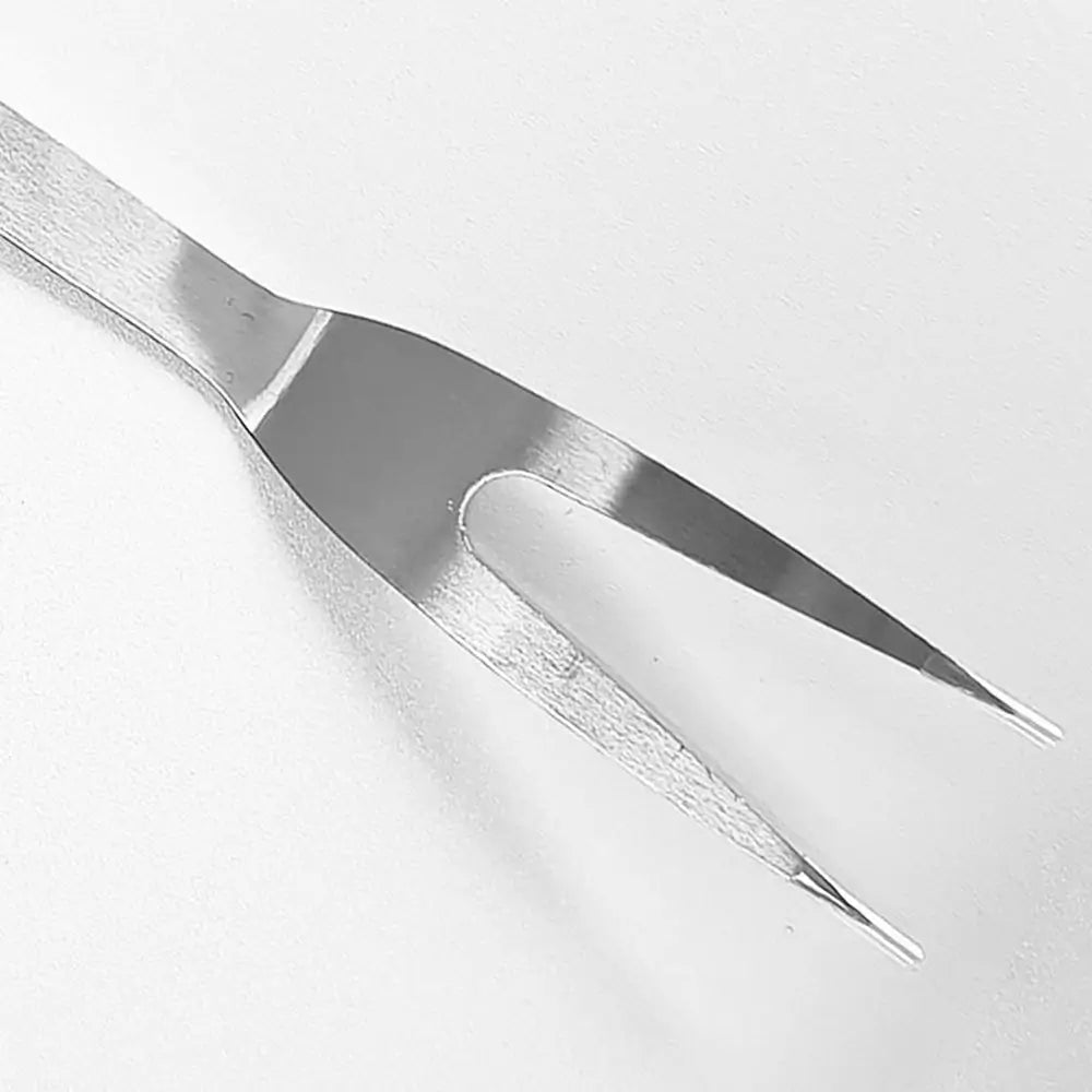 Close-up of a metal tool on a white background.