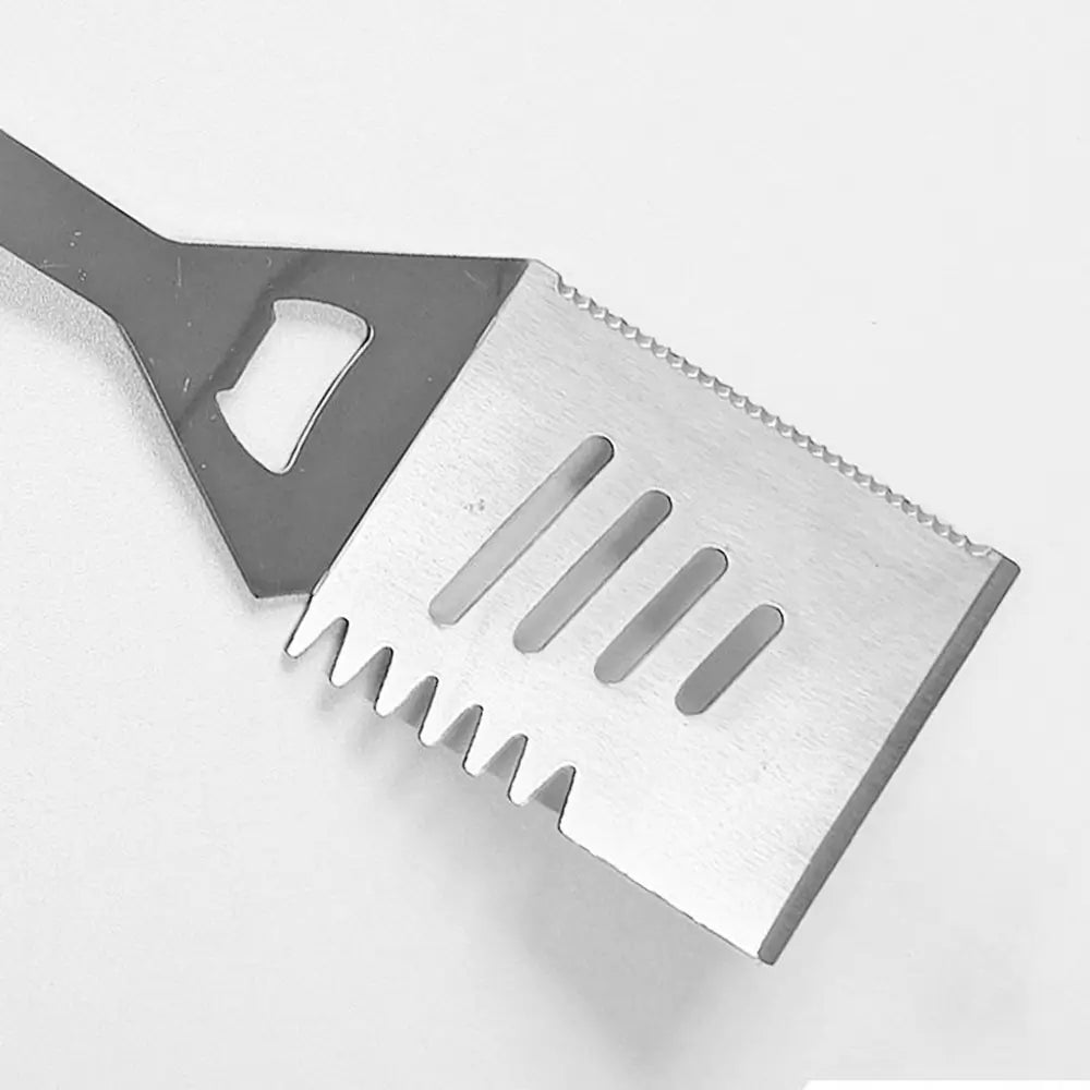 Metal spatula with a textured surface on a white background.