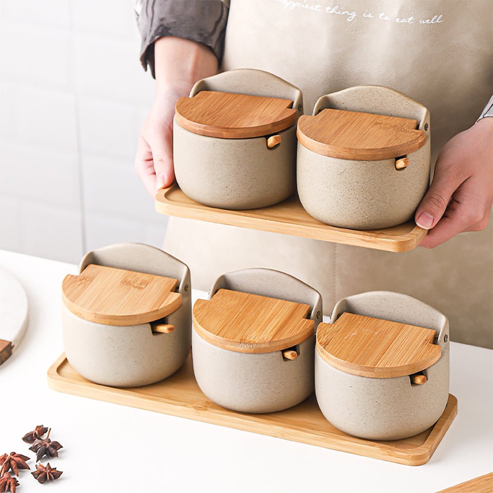 set of two and three condiment jars, with a woman holding the set of 2.