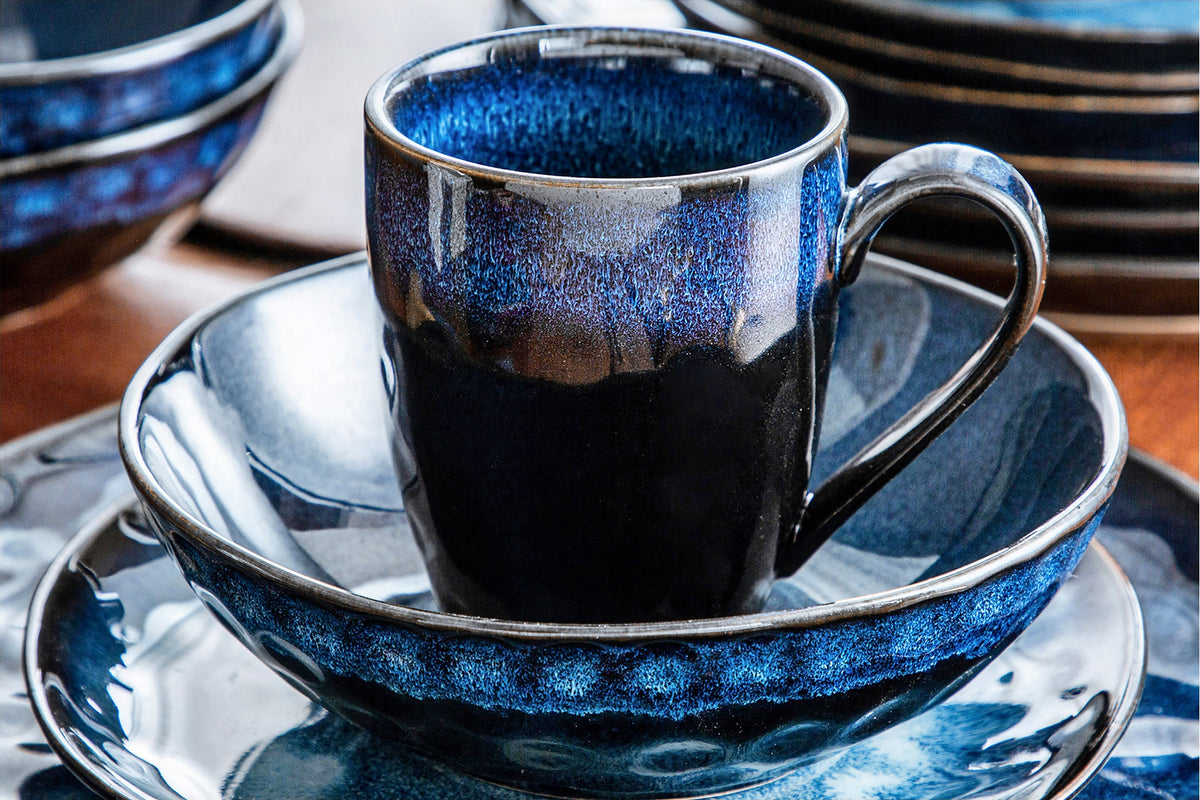 Close-up of a blue ceramic bowl and matching mug, part of the best affordable cookware set, showcasing stylish and budget-friendly kitchenware essentials.