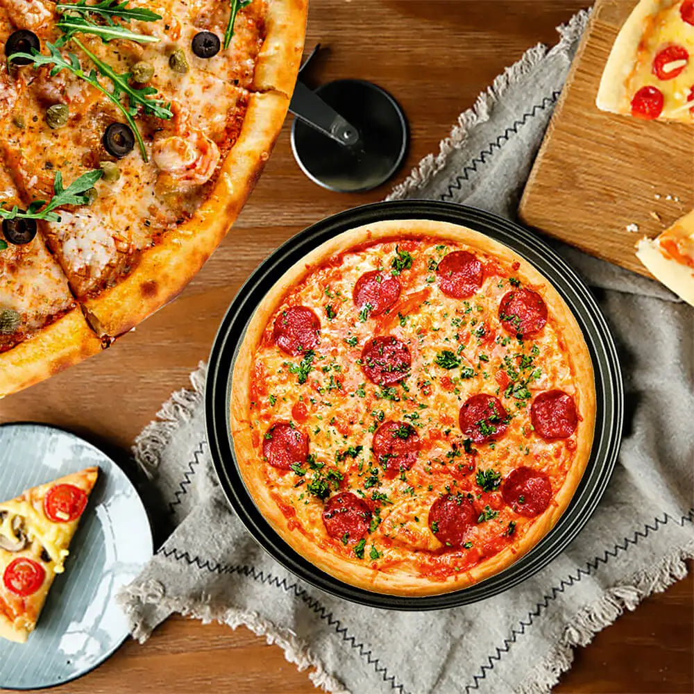 Freshly baked pepperoni pizza on a crisper pan surrounded by sliced pizzas on plates and boards, placed on a wooden table.