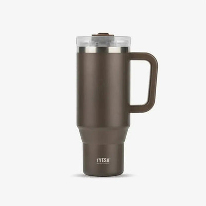 Brown TYESO thermal travel mug with handle and clear lid on a plain background.