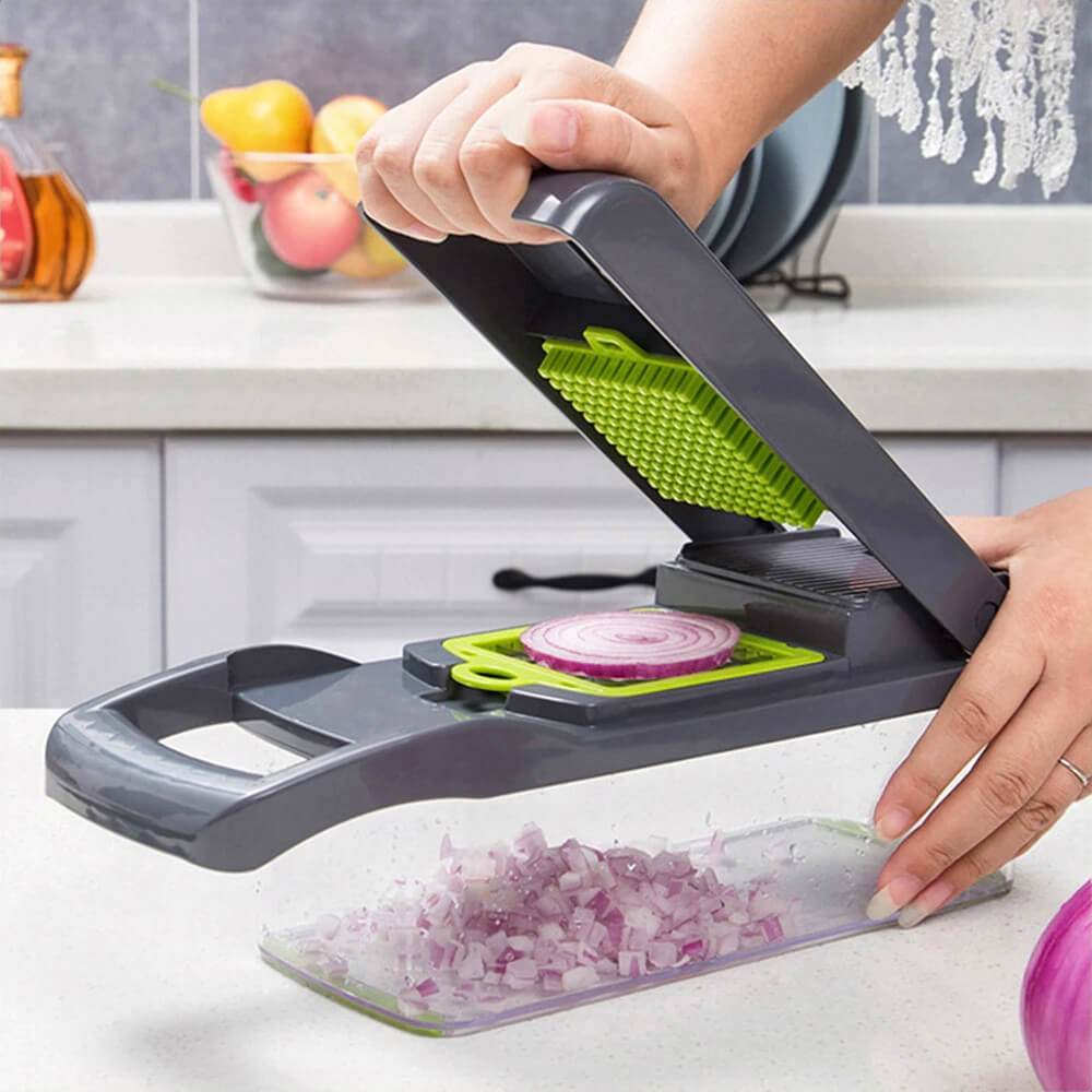 Person chopping onion slices with a best vegetable chopper, producing diced onions into a clear container on a kitchen countertop.