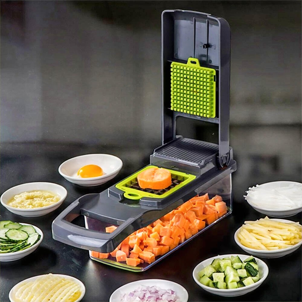 Best vegetable slicer and chopper slicing carrot cubes into container, surrounded by plates of chopped vegetables and ingredients.