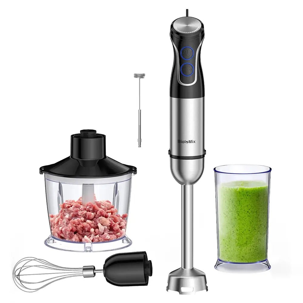Hand blender with attachments including a chopper, whisk, and container with green smoothie on a white background.