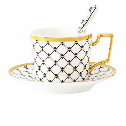 A luxurious blue tea cup and saucer set featuring an intricate honeycomb pattern with golden accents. The elegant design includes a matching spoon, making it a perfect addition to any tea collection.