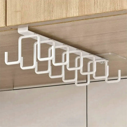 White cabinet racks mounted under a wooden shelf, featuring multiple sturdy hooks designed for hanging mugs, utensils, or tools, perfect for kitchen organization.