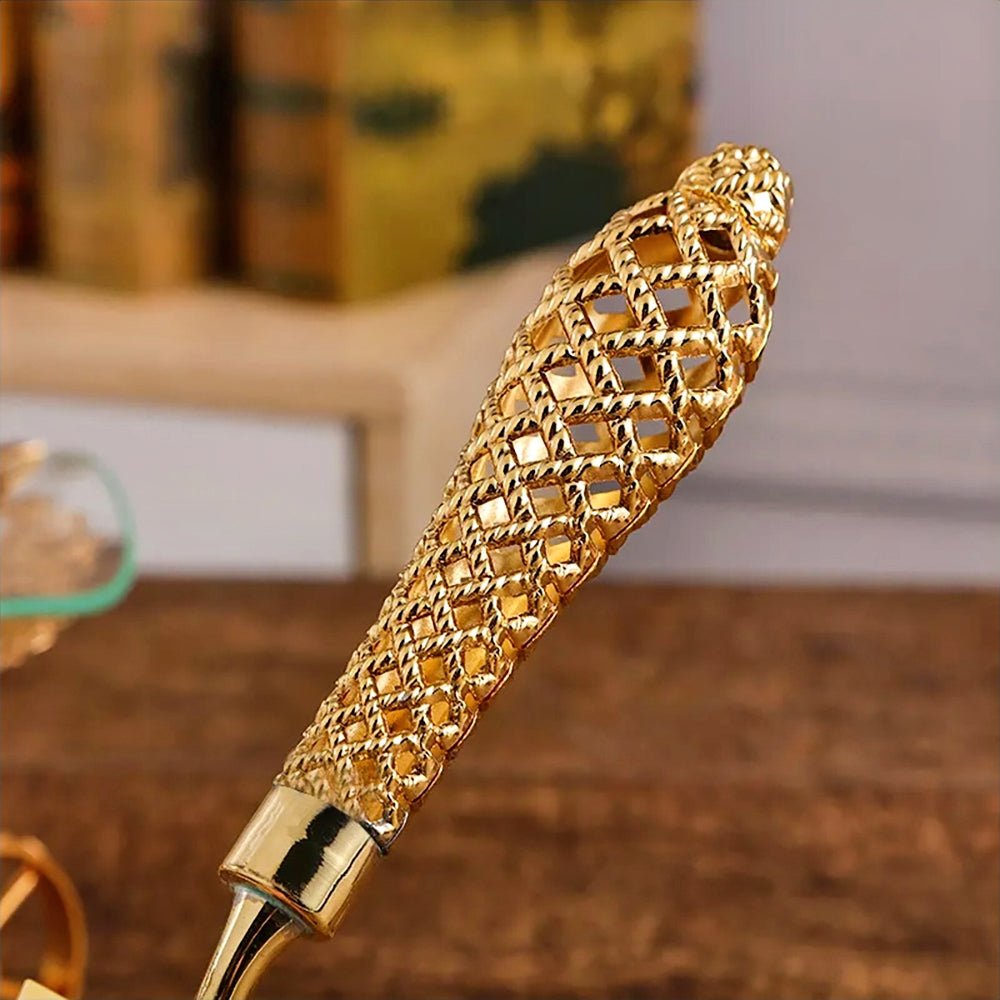 Gold cake server wedding set with intricate details, including knife and server. Perfect for special occasions.