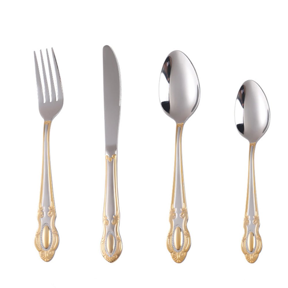 Casa Milano flatware set in stainless steel with gold-accented handles. Includes fork, knife, tablespoon, and teaspoon.