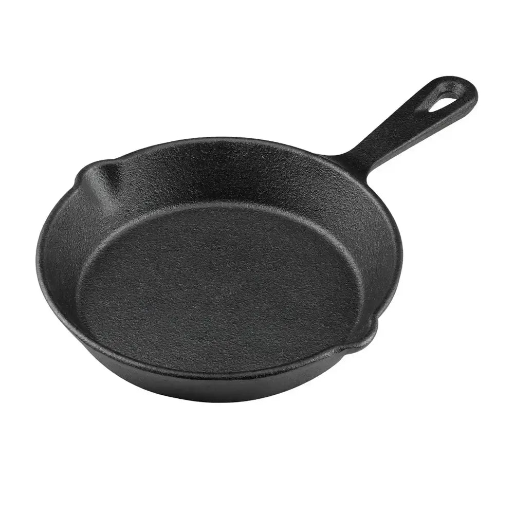 Black cast iron skillet on a white background