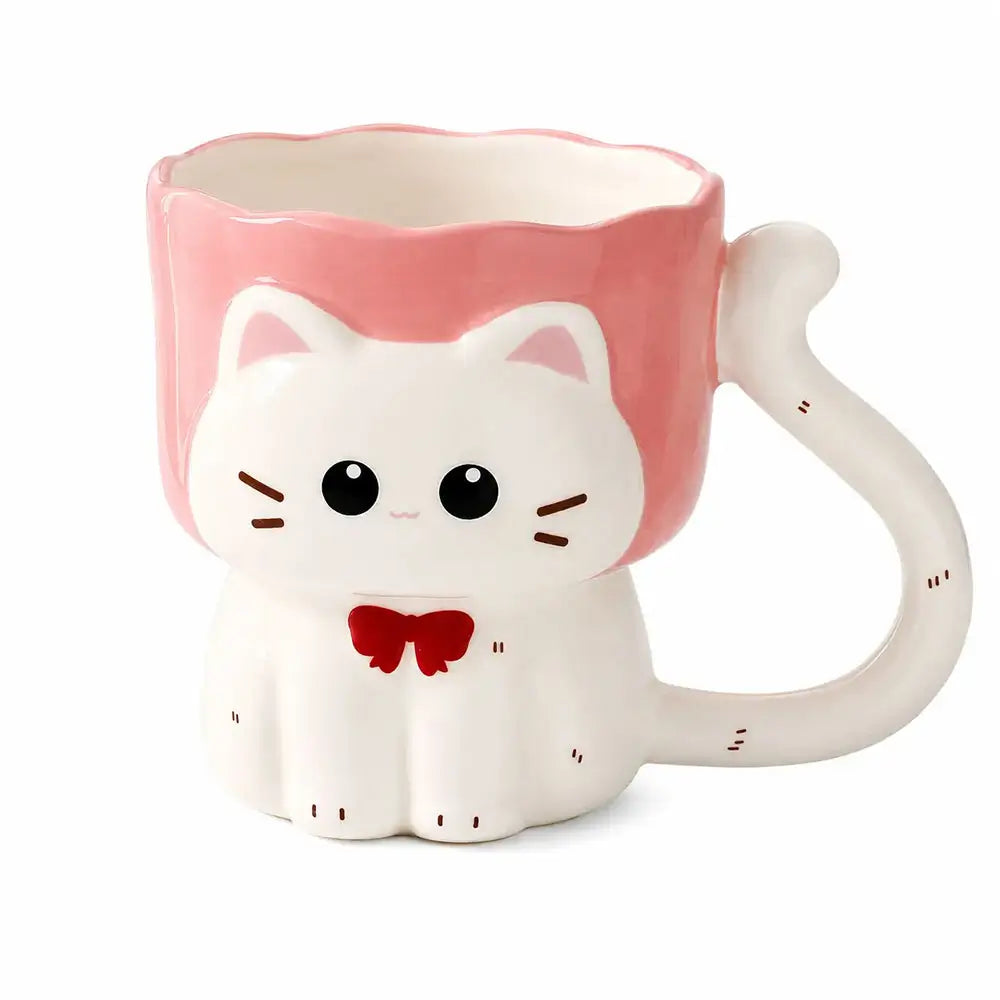 A ceramic cat-shaped mug with a white body, pink top rim, and a red bow tie, shown on a plain white background.