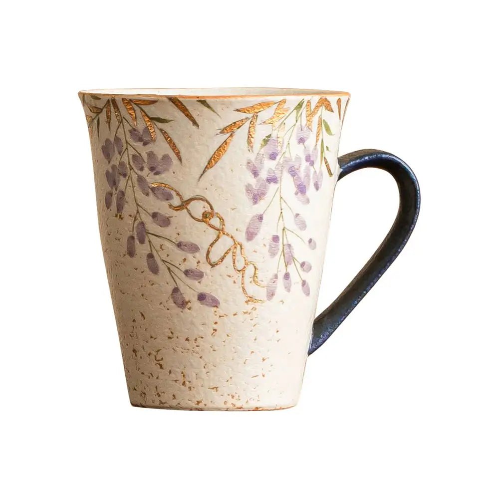 ceramic mug with floral pattern shown on a white background.