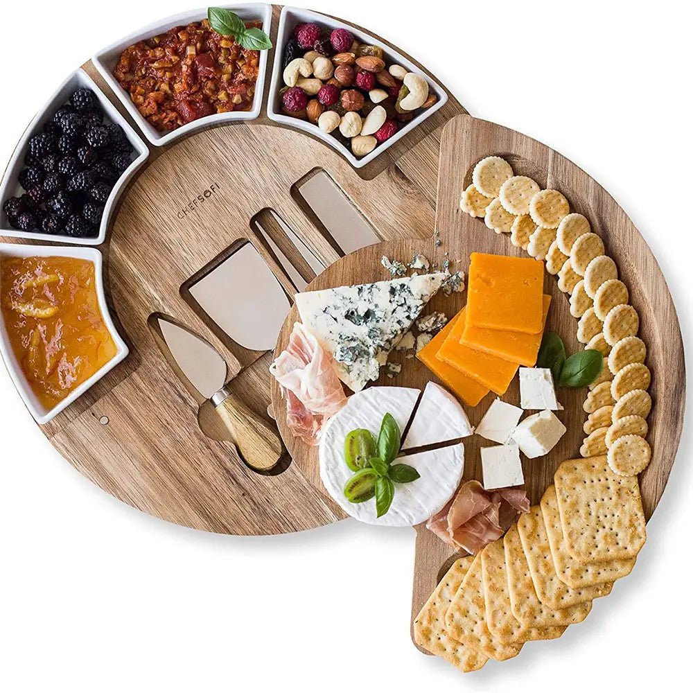 Wooden charcuterie board with assorted cheeses, crackers, and accompaniments on a white background.