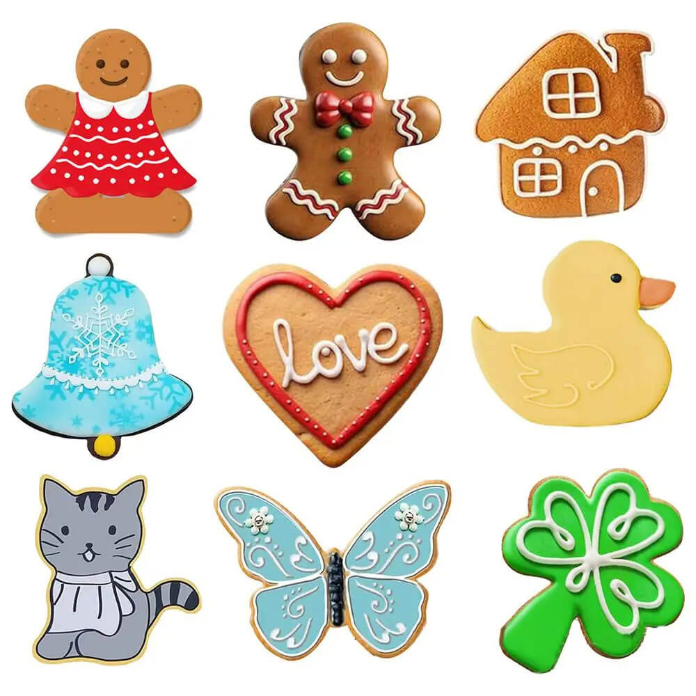 Decorated cookies made using Christmas cookie cutters, including a gingerbread girl, gingerbread boy, bell, house, heart, duck, cat, butterfly, and clover shapes.