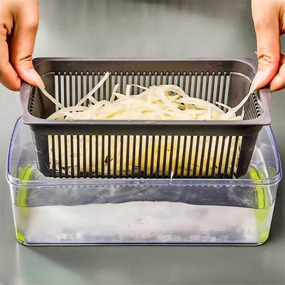 Hands holding strainer basket with sliced vegetables above clear container filled with water using commercial vegetable chopper.