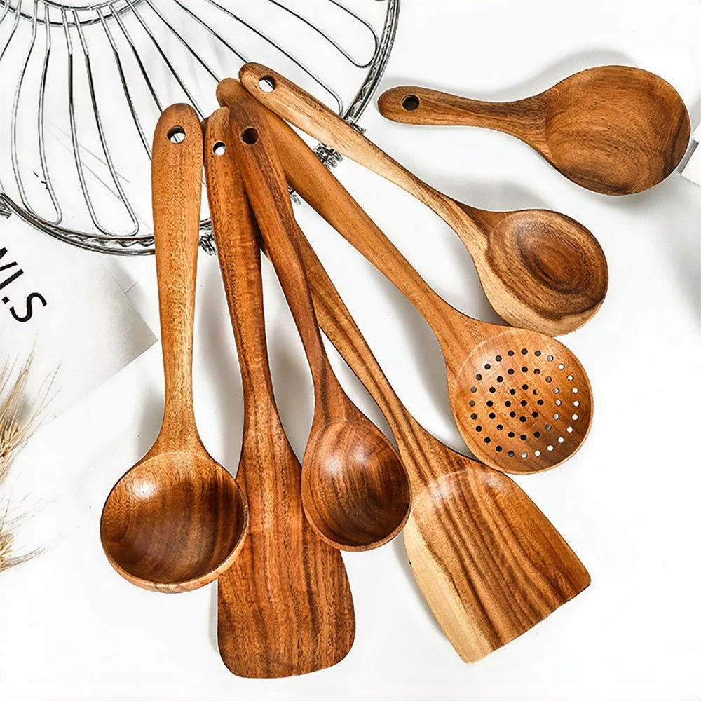 Seven cooking utensil set wood pieces on a kitchen counter, showcasing durable and stylish tools.