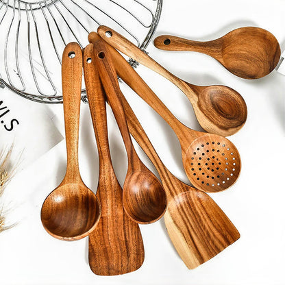 Cooking utensil set wood with seven natural wooden spoons and spatulas, ideal for mixing, stirring, serving, and cooking various dishes.