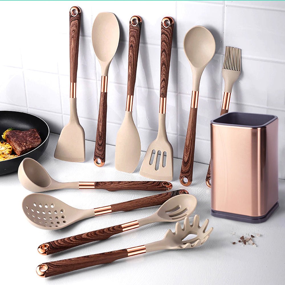 A set of cooking utensils for nonstick pans is displayed on a kitchen counter next to a utensil holder.