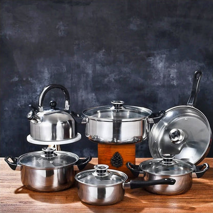 Cookware sets on sale: Three stockpots, a saucepan, frypan, and tea kettle with Bakelite handles, showcasing a complete kitchen collection at a great price.