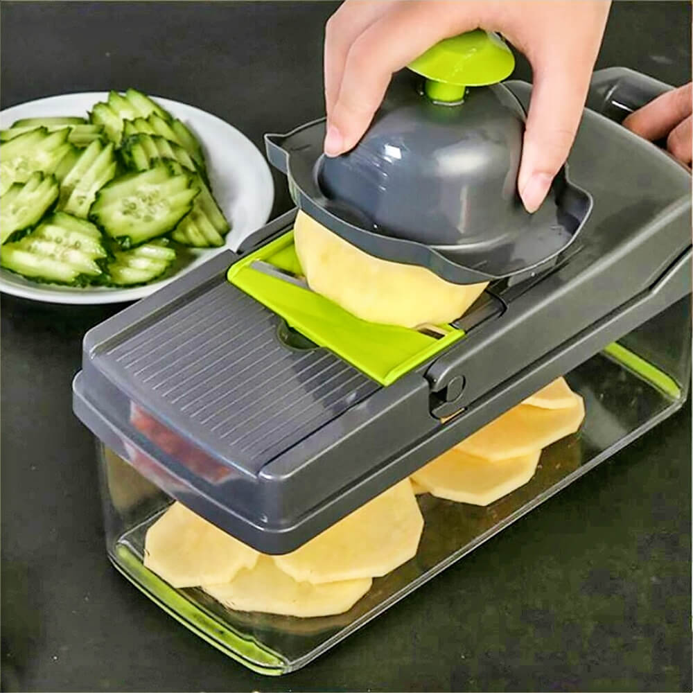 Hand slicing potato with dice shred and slice vegetable chopper into thin slices collected in container, cucumber slices nearby.
