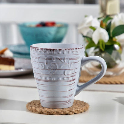 Dinnerware set stoneware, featuring a mug as part of the elegant collection.