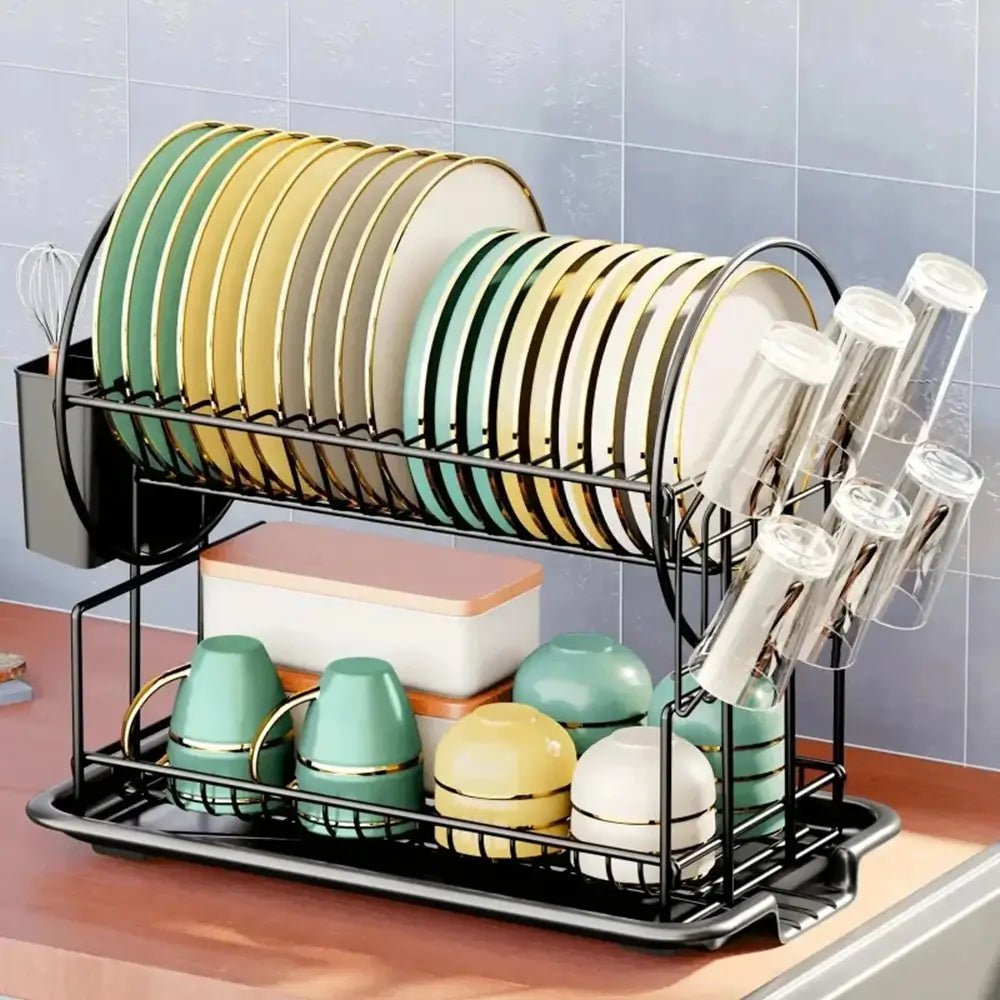 Dish rack with plates, cups, and bowls on a kitchen counter.