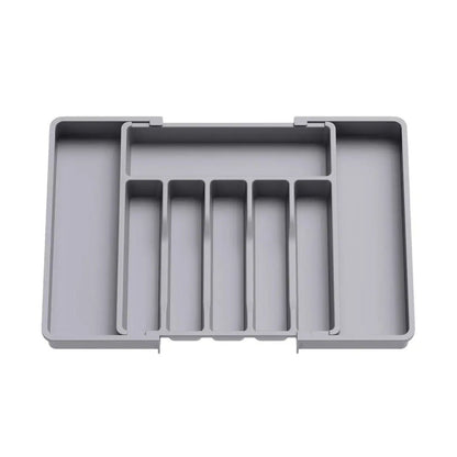 Grey drawer organizer expandable, with adjustable sides and multiple compartments for neat and versatile storage.